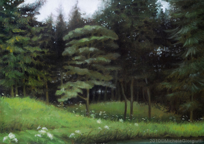 Veduta di bosco verde in riva al lago